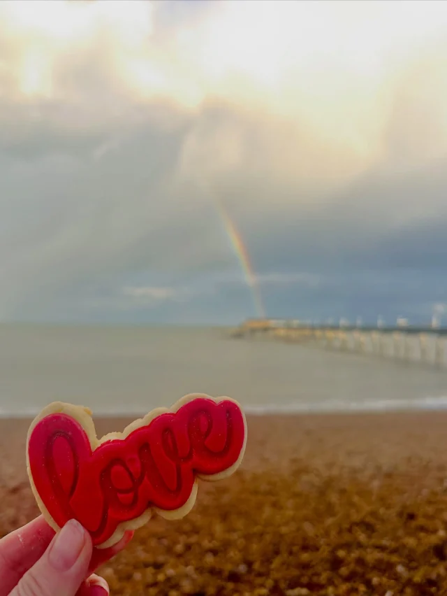 I’m not what I love most - the drama of the clouds, the warm sunshine after the rain shower, the rainbow perfectly positioned over the pier, or the ambition to hold onto the spirit of love with what can only be described as the most delicious biscuit ever. 

Maybe, just maybe it’s a combination of it all which together made a magical moment at the coast. 

The beach was quiet, the sound of the waves on the shore was loud and THAT view was in front of me. 

Heaven!
This is the magic of the Kent coast. 

#dealkent #kentcoastline 
#thisiswhyyouvisit 
#coastalgetaway #rechargeyoursoul 
🍪 @thelanebakery